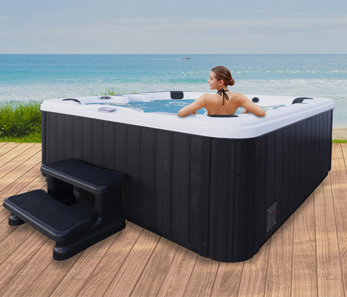 Hot Tubs, Spas, Portable Spas, for sale American Spas American Spas hot tub being used in a family setting